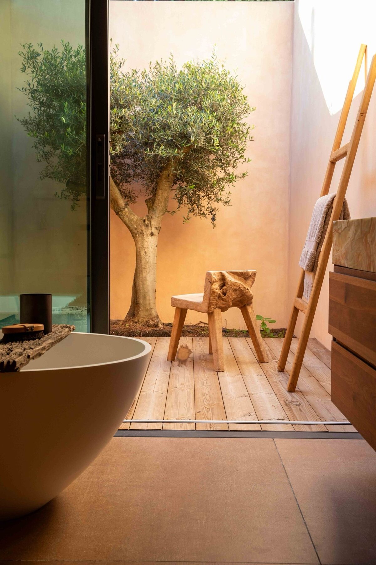 A bathroom open to the green